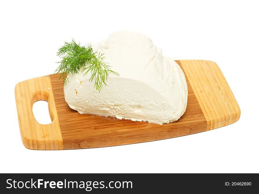 Natural cottage cheese on wooden board isolated on white