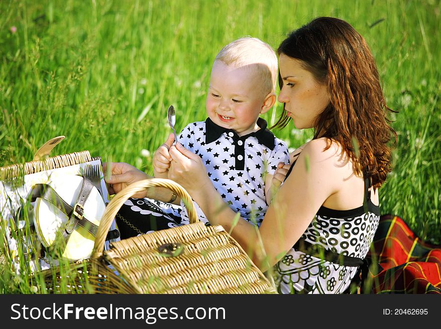 Picnic of happy family on green grass. Picnic of happy family on green grass