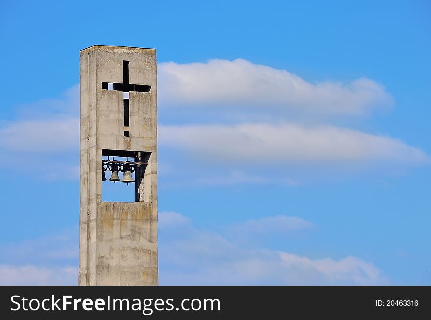 Cross on Belfry of Modern Christian Church Under Blue Sky