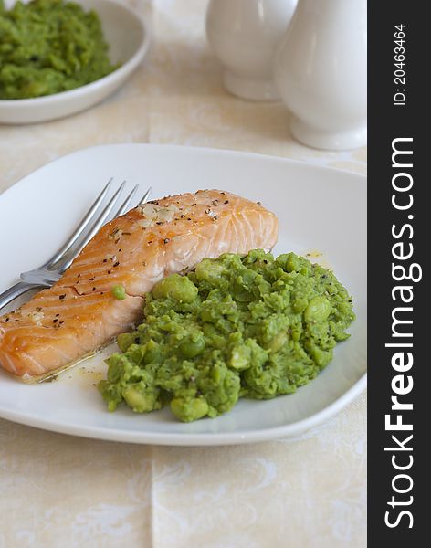 Grilled salmon with crushed minted peas and lemon dressing. Grilled salmon with crushed minted peas and lemon dressing