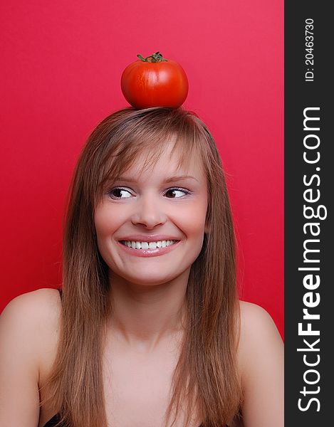 Portrait of a young woman on red