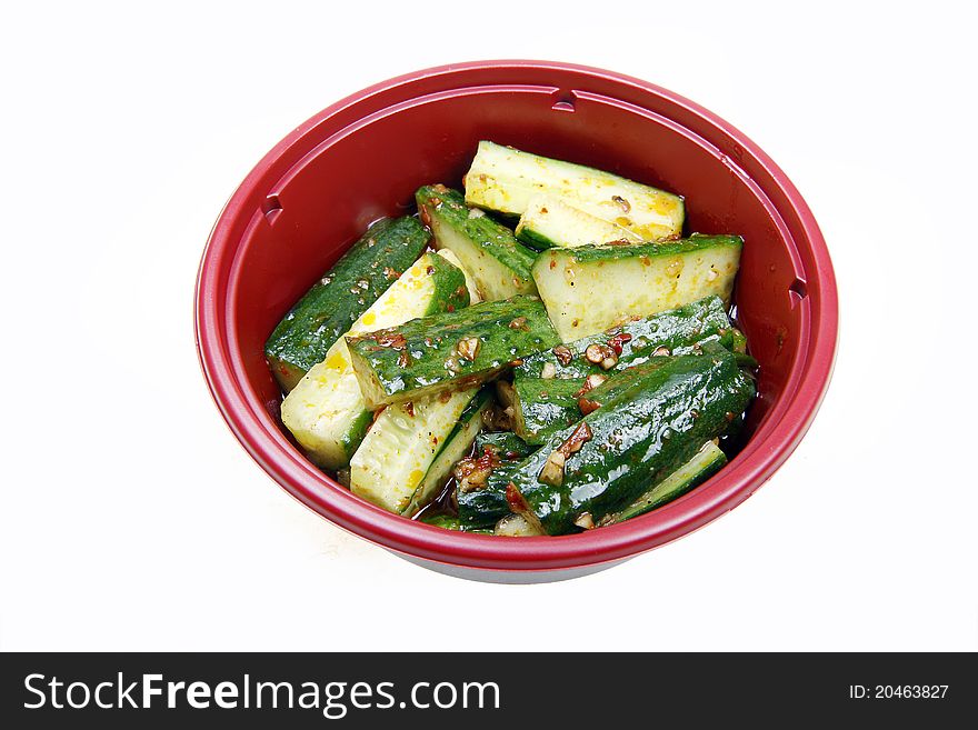 Chinese cold dish in the bowl. Chinese chili oil mixed with cucumber, it is a famous appetizer in China. Chinese cold dish in the bowl. Chinese chili oil mixed with cucumber, it is a famous appetizer in China.