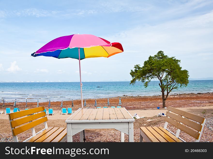 Beach Chair And Colorful Umbrella At  On The Beach