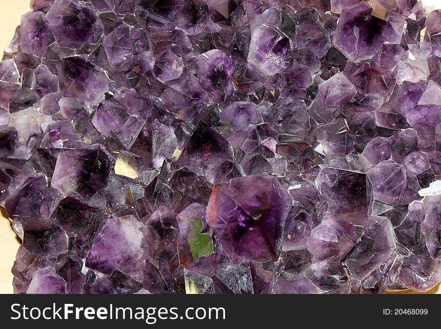 The druse of purple amethyst crystals
