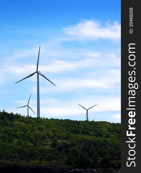 Wind turbines generate green energy at a windfarm. Wind turbines generate green energy at a windfarm