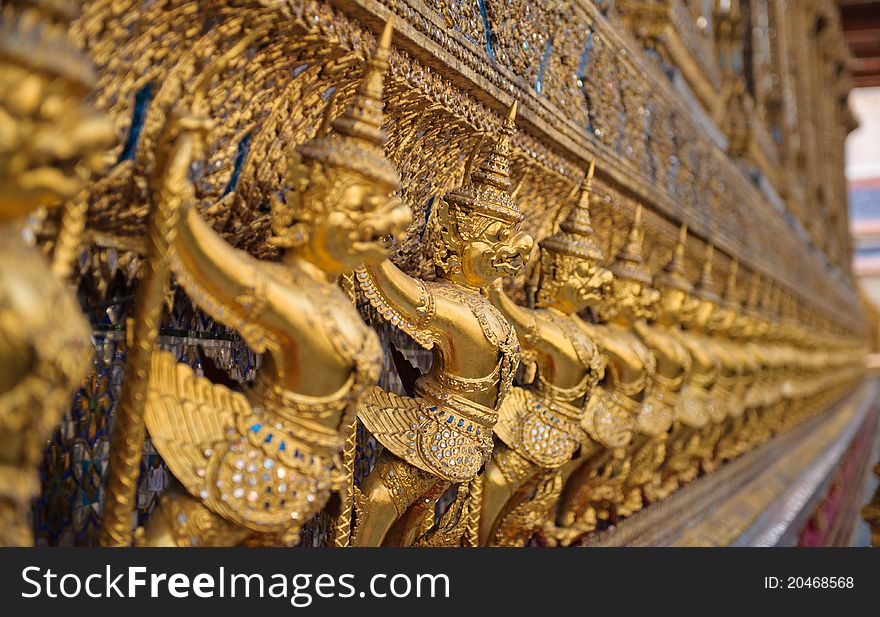 Golden Statue archway in a thai temple in thailand