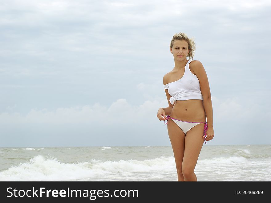 Sexy Blond Girl On A Beach