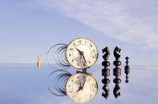 Clock And Chessmans On Mirror Royalty Free Stock Images