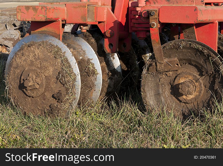 Disk Ripper in the field. Plough is a tool used in farming for initial cultivated of the soil