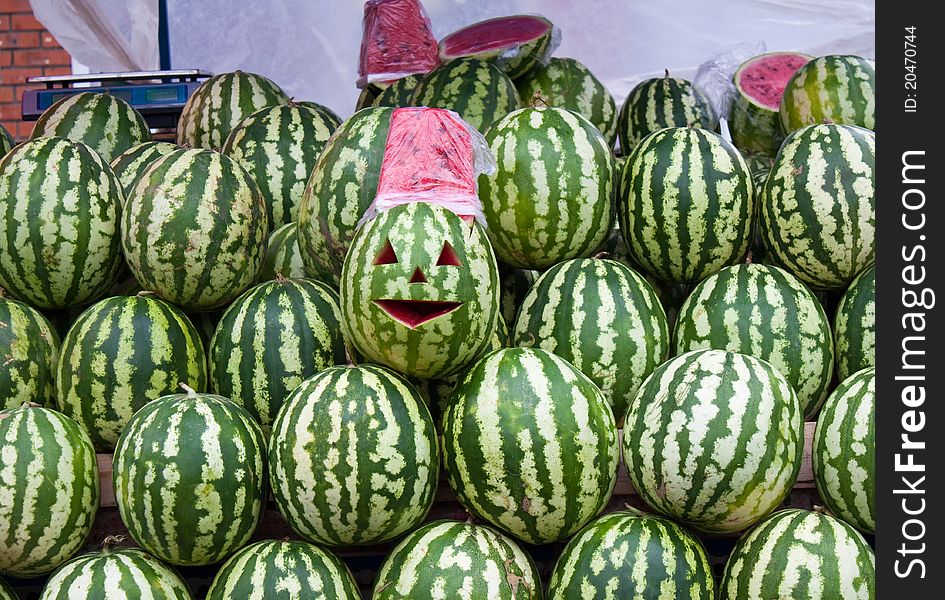 The heap of water-melons exposed on sale in the market (close-up). The heap of water-melons exposed on sale in the market (close-up)