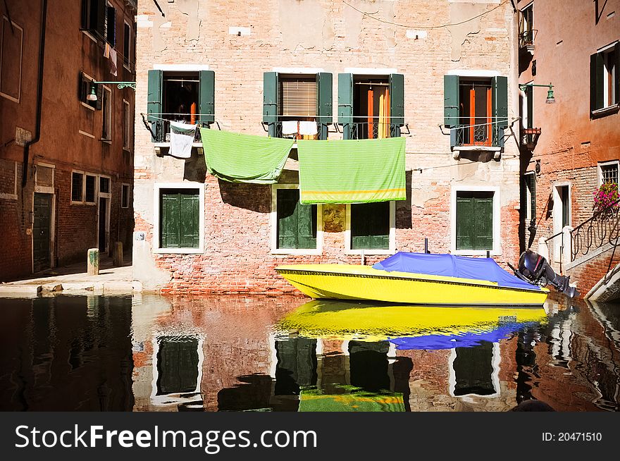 Colorful boat reflection in the water in Venice (Italy). Colorful boat reflection in the water in Venice (Italy)
