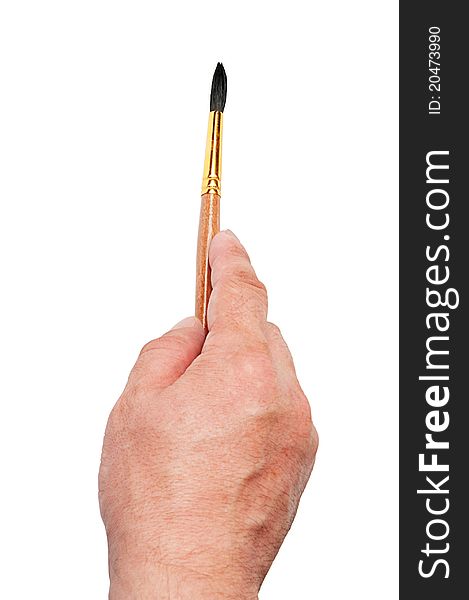 Hand holding paint brush isolated on white background