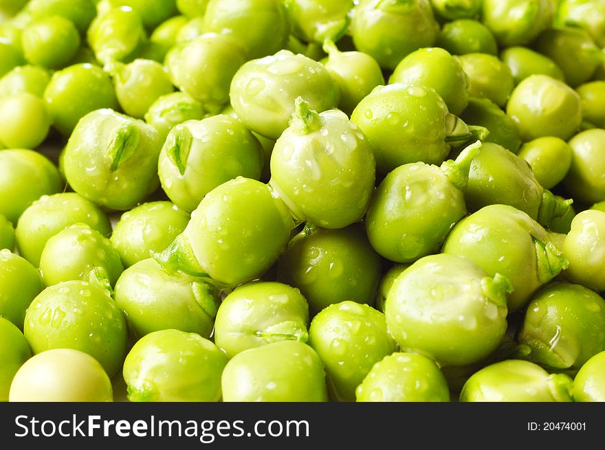 Fresh green peas with waterdrops