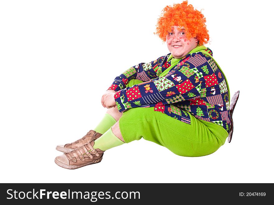 A man dressed Carlson, a clown with a propeller. White background. Studio photography. A man dressed Carlson, a clown with a propeller. White background. Studio photography.