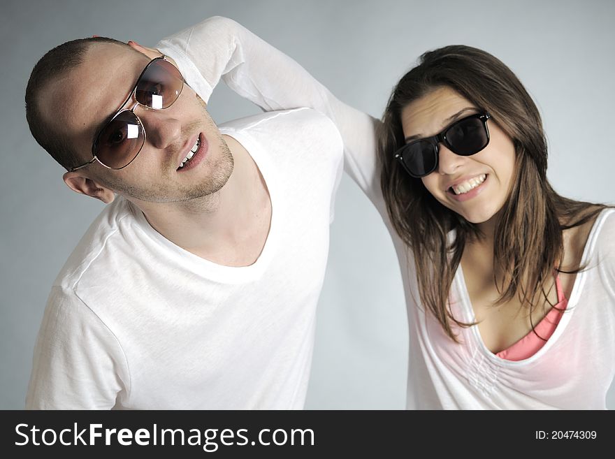 Beautiful girl and young man with sunglasses having fun. Beautiful girl and young man with sunglasses having fun