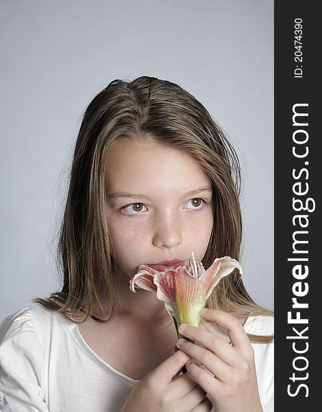 Girl smelling flower