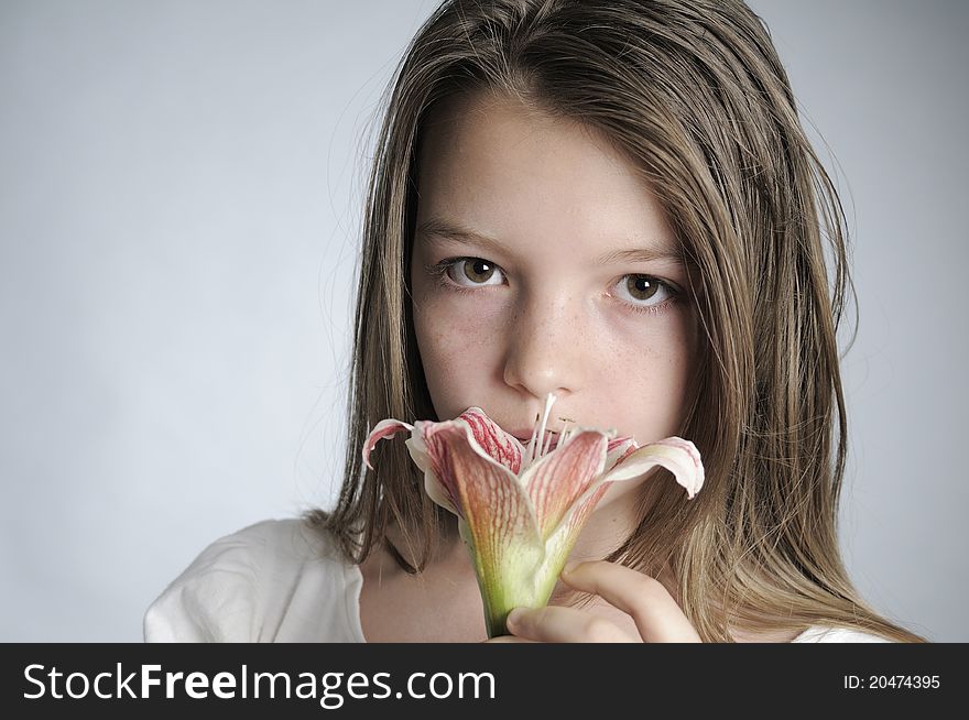 Teenager Smelling Flower