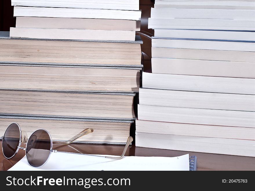 Books and volumes on the table. Books and volumes on the table