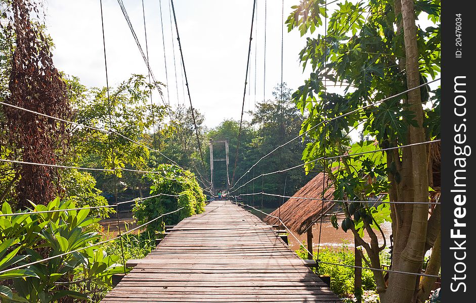 Wooden suspension bridge cross the river