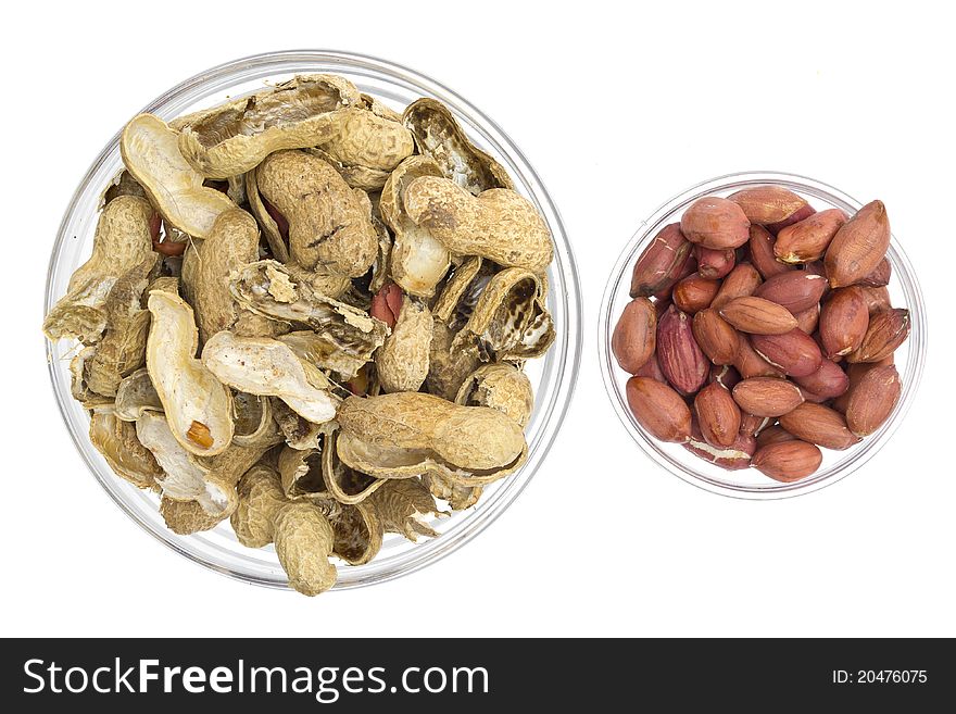 Peanuts in a glass bowl isolated on the white