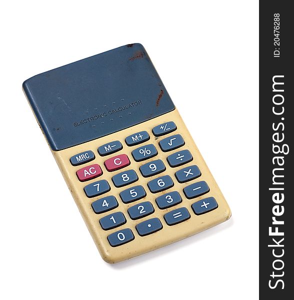 Basic calculator from the late 1970s. On white background. Note: There are visible scratch marks, dents and dirt on this item.