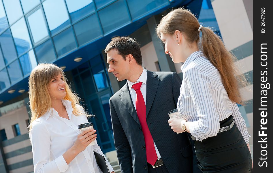 Business people have a coffee break in a modern downtown. Business people have a coffee break in a modern downtown.