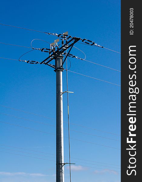 Electric high-voltage pole on the background of blue sky. Electric high-voltage pole on the background of blue sky