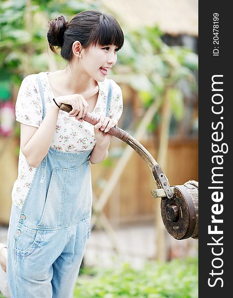 Chinese city girl enjoying the fun of farm life. Chinese city girl enjoying the fun of farm life.