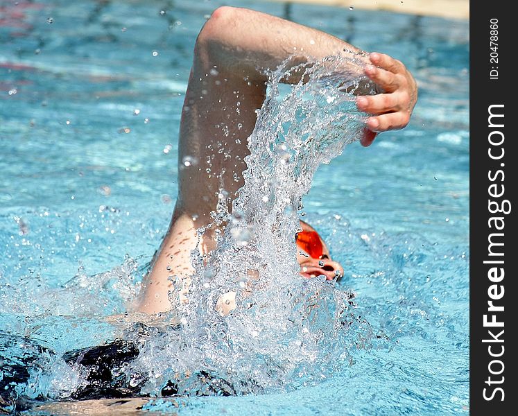 Professional Freestyle Swimmer in the outdoor pool. Professional Freestyle Swimmer in the outdoor pool