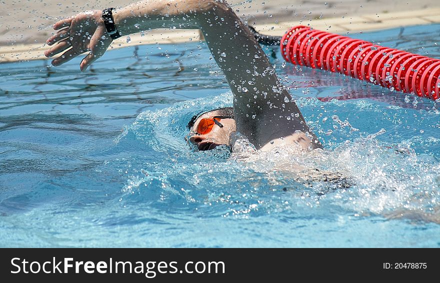 Professional Freestyle Swimmer in the outdoor pool. Professional Freestyle Swimmer in the outdoor pool