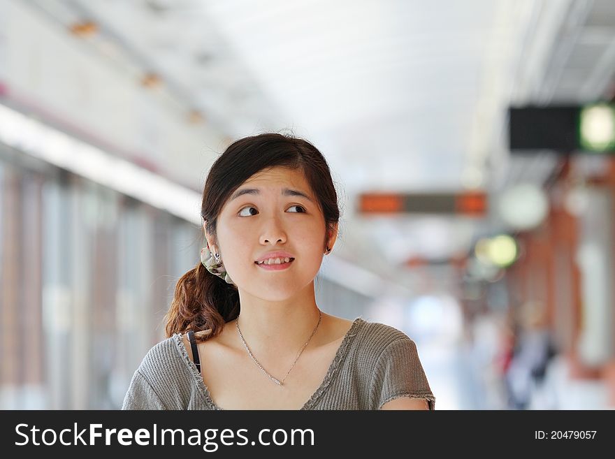 Asian woman thinking with curiousity