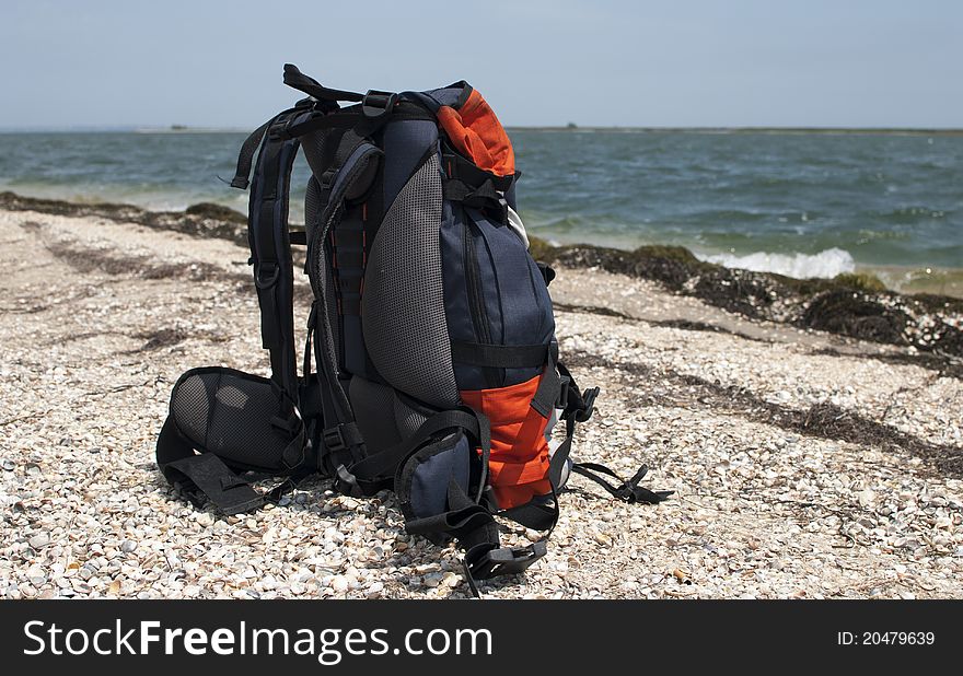 Big backpack on the sea coast. Big backpack on the sea coast