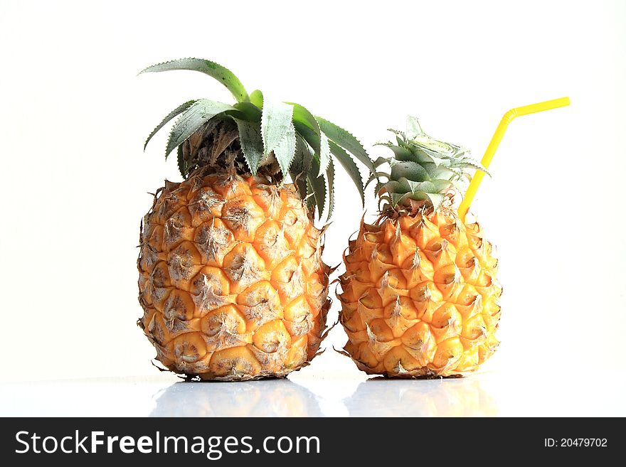 Ripe pineapple, and straw and water. Ripe pineapple, and straw and water.