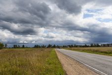 The Road Into The Field Royalty Free Stock Image The Road Into The Field Royalty Free Stock Image
