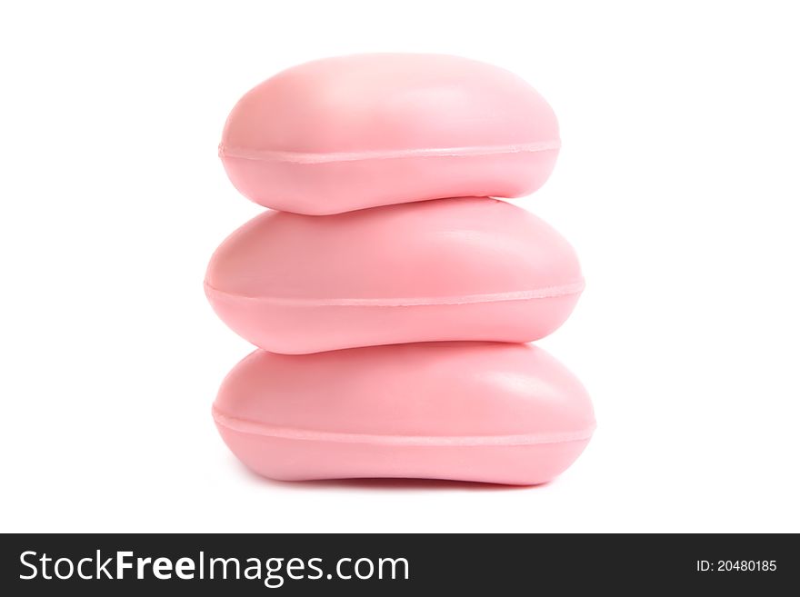 Three pieces of scented pink soap on white background. Three pieces of scented pink soap on white background