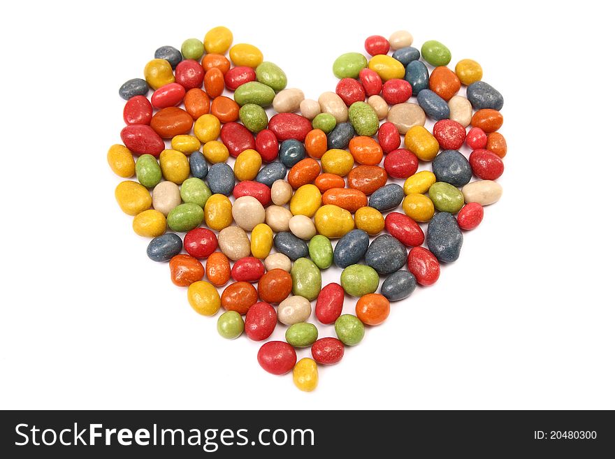 Colorful tasty candy in the shape of heart - isolated on white background. Colorful tasty candy in the shape of heart - isolated on white background