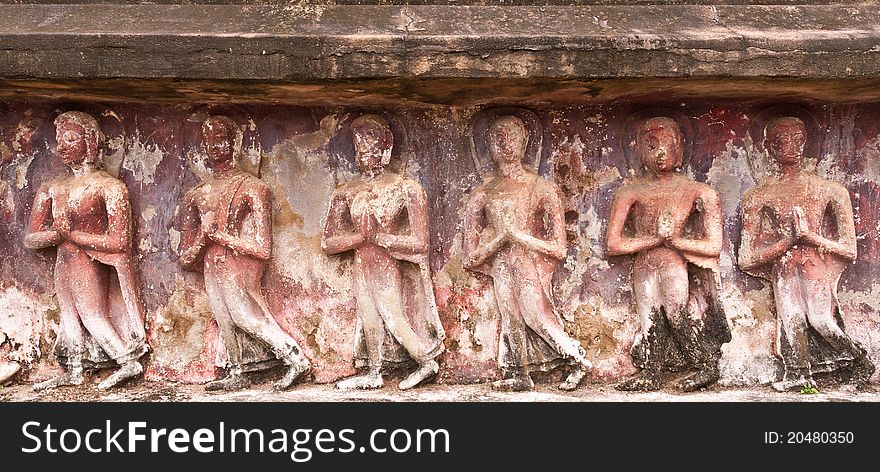 Ruin standing Buddha images on wall in Sukhothai historic park. Ruin standing Buddha images on wall in Sukhothai historic park