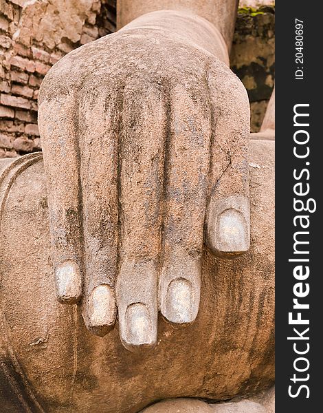 Hand of ruin Buddha statue in Sukhothai historic park vertical. Hand of ruin Buddha statue in Sukhothai historic park vertical