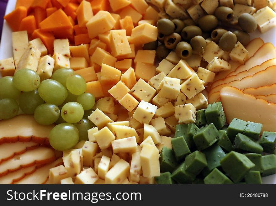 Bowl of various diced cheese