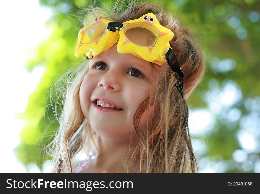 Portrait of a smiling girl with goggles