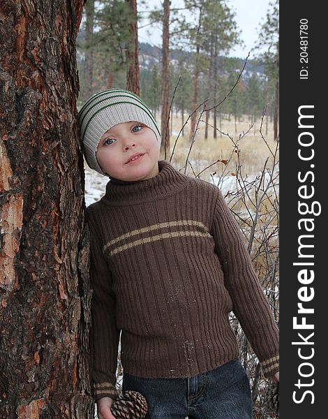 Warmly dressed boy outside in the snow. Warmly dressed boy outside in the snow