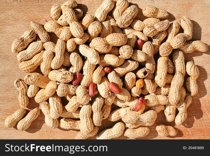 Roast peanuts on wooden board outdoor