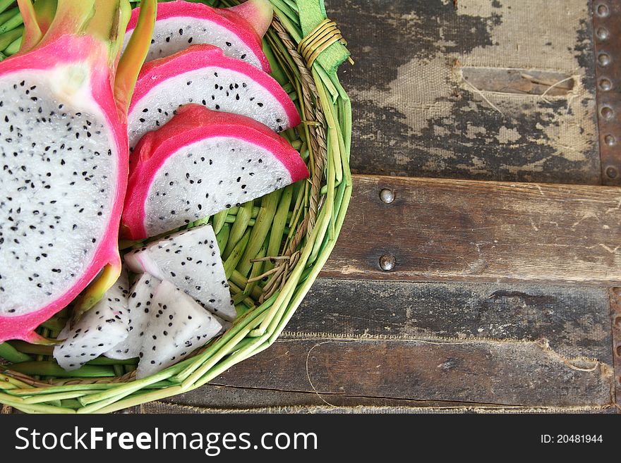 Pink pitahaya dragon fruit background sliced in pieces