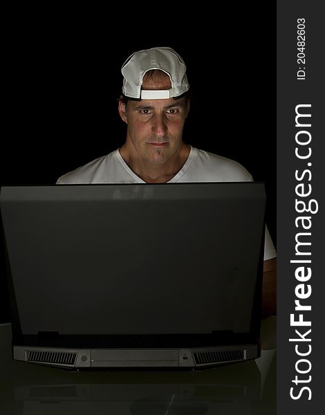 Mature man surfing the net with a laptop