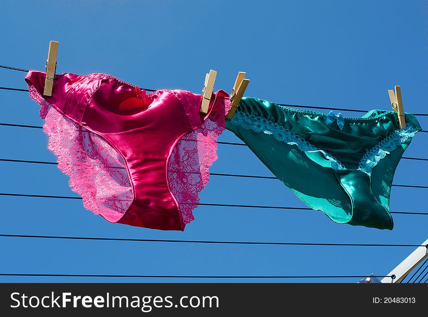 Lesbian concept of silk knickers on washing line