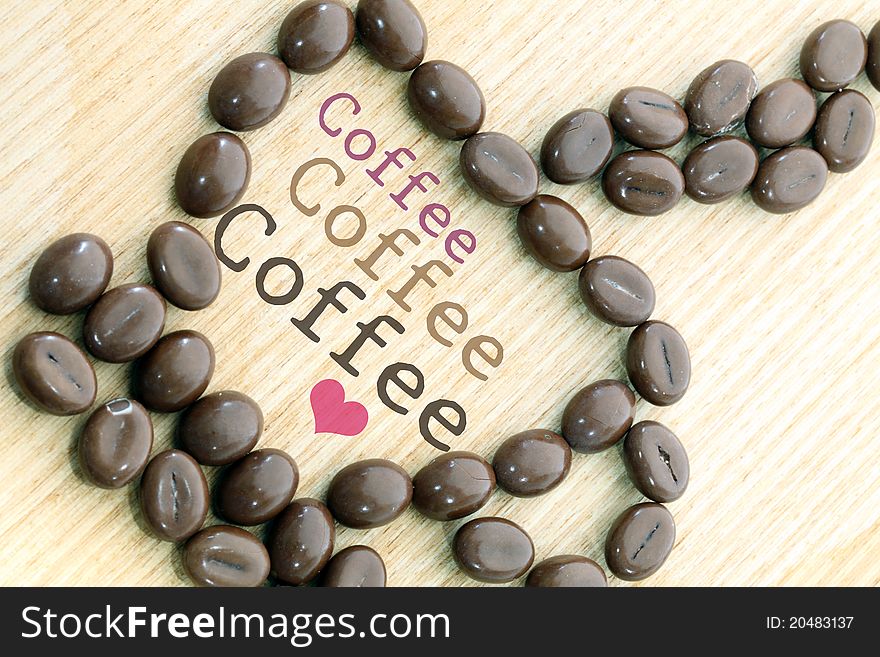 Cup of coffee on wood background.