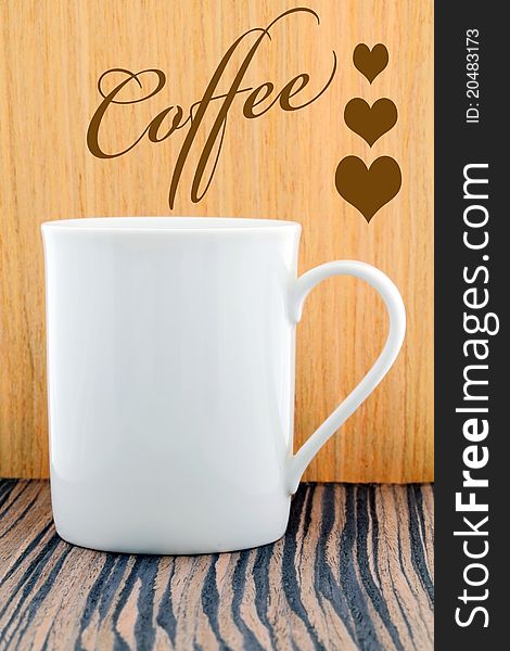 Cup of coffee on wood background.