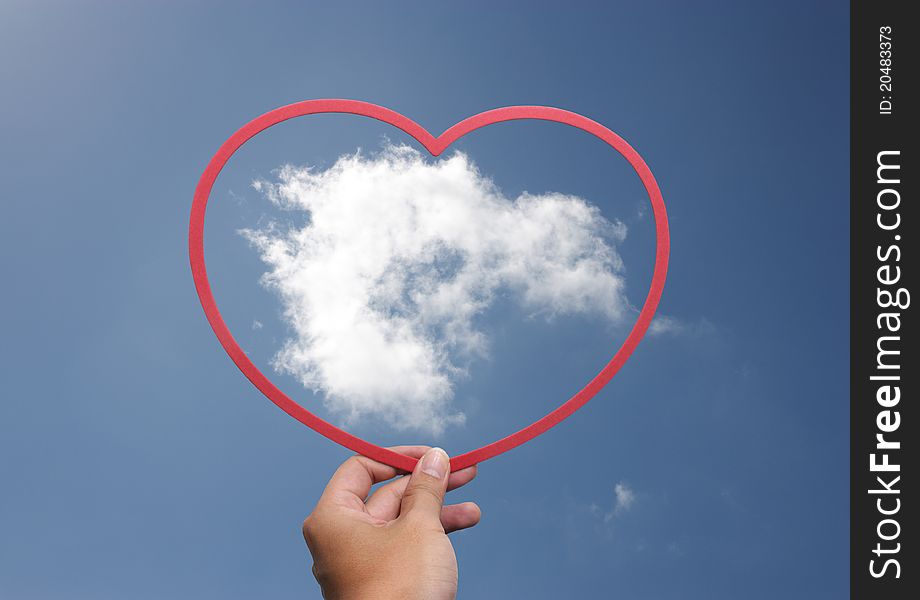 Hands taking a heart with the cloud inside. Hands taking a heart with the cloud inside