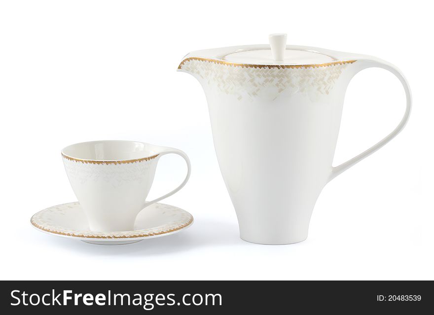 Cup and the teapot is isolated on a white background