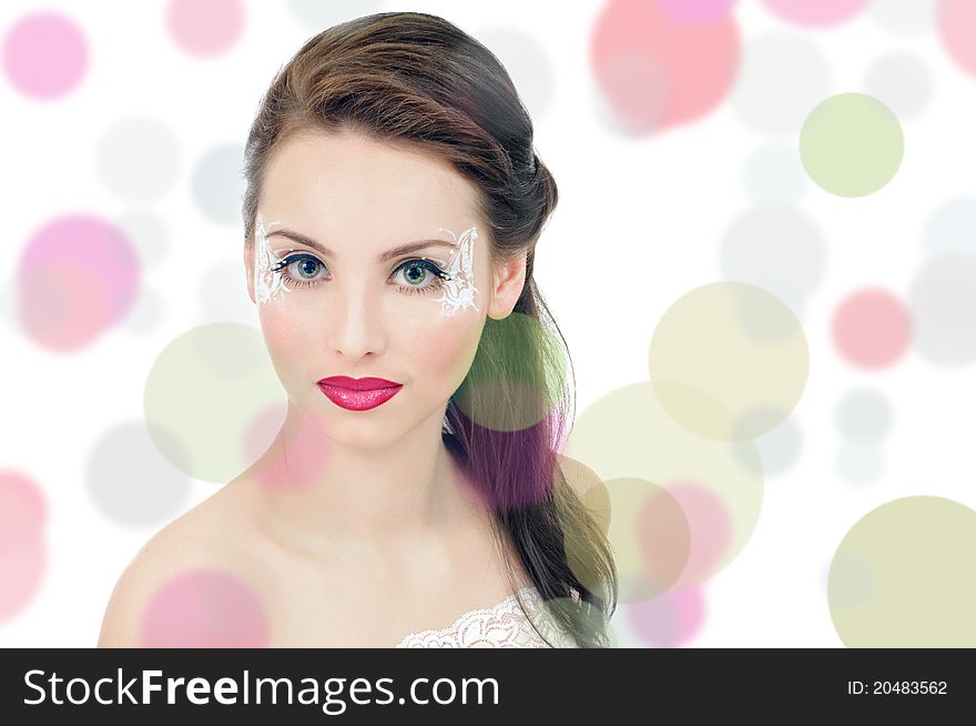 Portrait of beautiful girl with art make up on white. Portrait of beautiful girl with art make up on white